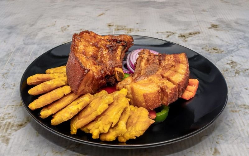 Craving something delicious? Our Chicharrón Frangrill is calling your name, served with a side of your choice and made with love at the best Dominican restaurant in Lawrence!