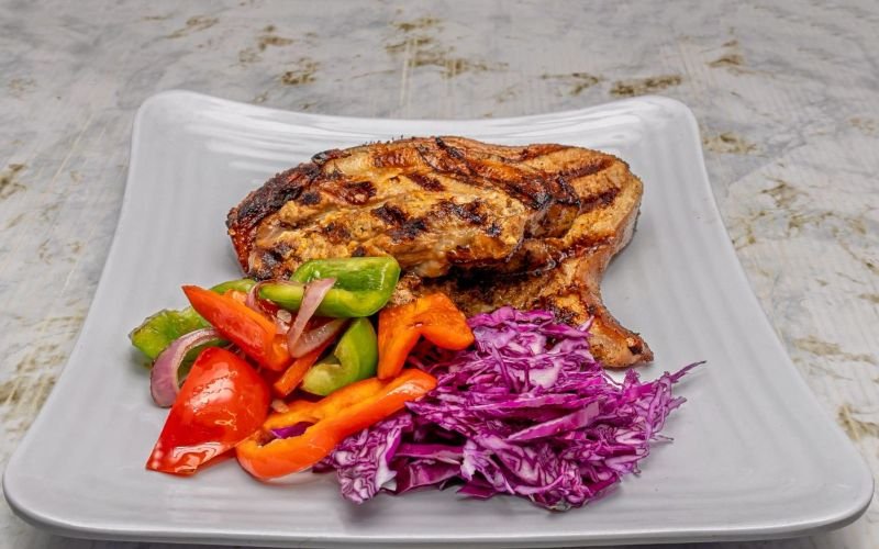 Say goodbye to boring diets and hello to our mouthwatering grilled pork! Packed with flavor and free from refined oils, it’s the perfect choice for your weight loss journey. Experience the best Dominican food in Lawrence, Massachusetts—order now!